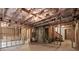 Unfinished basement with exposed ceiling, and framed walls at 7340 Jamestown Dr, Alpharetta, GA 30005