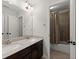 Bathroom boasts double sinks, a large mirror, and a shower with a curtain at 7340 Jamestown Dr, Alpharetta, GA 30005