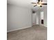 Spacious bedroom featuring plush carpeting, ceiling fan and neutral color palette at 7340 Jamestown Dr, Alpharetta, GA 30005