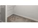 A basic walk-in closet with carpet and standard wire shelving for storage at 7340 Jamestown Dr, Alpharetta, GA 30005