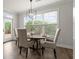 Cozy dining area with natural light and a backyard view at 7340 Jamestown Dr, Alpharetta, GA 30005