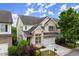 Charming two-story brick home featuring a two-car garage and beautifully landscaped front yard at 7340 Jamestown Dr, Alpharetta, GA 30005