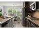 Modern kitchen with granite countertops, stainless appliances, and natural light at 7340 Jamestown Dr, Alpharetta, GA 30005