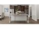 Kitchen island with granite countertops, seating, and stainless steel appliances at 7340 Jamestown Dr, Alpharetta, GA 30005
