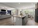Kitchen island with granite countertops and view of the living and dining areas at 7340 Jamestown Dr, Alpharetta, GA 30005