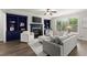 Cozy living room with built-in bookshelves, a fireplace, and a large window at 7340 Jamestown Dr, Alpharetta, GA 30005