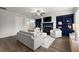 Inviting living room with built-in shelving, a fireplace, and hardwood floors at 7340 Jamestown Dr, Alpharetta, GA 30005