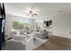 Open living room with hardwood floors, neutral paint, and bright natural light at 7340 Jamestown Dr, Alpharetta, GA 30005