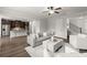 Spacious living room open to the kitchen and dining area with hardwood floors at 7340 Jamestown Dr, Alpharetta, GA 30005