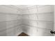Spacious walk-in closet with adjustable white wire shelving and clean white walls at 7340 Jamestown Dr, Alpharetta, GA 30005