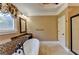 Stylish bathroom with a soaking tub, marble countertops, a chandelier, and a glass-enclosed shower at 2230 Cammie Wages Rd, Dacula, GA 30019