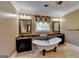 Charming bathroom features a soaking tub, double sink vanity with framed mirrors, and designer finishes at 2230 Cammie Wages Rd, Dacula, GA 30019