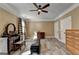 Large bedroom features wood-look floors, plaid curtains and furniture at 2230 Cammie Wages Rd, Dacula, GA 30019