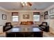 Wide shot of a bedroom with furniture, ceiling fan, wood-look flooring and neutral walls at 2230 Cammie Wages Rd, Dacula, GA 30019