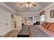 Bedroom with ceiling fan, wood-look flooring, neutral walls, and two closets at 2230 Cammie Wages Rd, Dacula, GA 30019