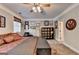 Spacious bedroom with neutral walls, ceiling fan and an assortment of decorative wall art at 2230 Cammie Wages Rd, Dacula, GA 30019