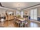 Elegant dining room features dark-stained hardwood floors and a chandelier at 2230 Cammie Wages Rd, Dacula, GA 30019