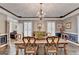Dining room showcasing hardwood floors, chandelier lighting, molding detail, and lots of natural light at 2230 Cammie Wages Rd, Dacula, GA 30019