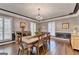 Beautiful dining room with a chandelier, plantation shutters, hardwood floors, and neutral paint at 2230 Cammie Wages Rd, Dacula, GA 30019