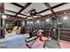 Spacious exercise room with coffered ceilings, and equipped with workout machines and fitness equipment at 2230 Cammie Wages Rd, Dacula, GA 30019