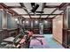 Elegant exercise room with coffered ceilings, fitness equipment, and a sauna for a home gym experience at 2230 Cammie Wages Rd, Dacula, GA 30019
