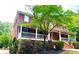 Beautiful two-story brick home with a covered porch and professionally landscaped yard at 2230 Cammie Wages Rd, Dacula, GA 30019