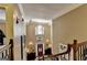 Grand two-story foyer featuring hardwood floors, chandelier and a beautiful staircase at 2230 Cammie Wages Rd, Dacula, GA 30019