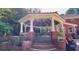 The outdoor gazebo has white columns, brick accents, and a ceiling fan to maximize your comfort at 2230 Cammie Wages Rd, Dacula, GA 30019
