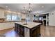 Bright kitchen with large island, stainless appliances, granite countertops, and an adjacent dining area at 2230 Cammie Wages Rd, Dacula, GA 30019