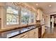 The kitchen features white cabinetry, stainless steel appliances, and granite countertops with a window view at 2230 Cammie Wages Rd, Dacula, GA 30019