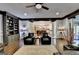 Spacious living room with built-in shelving, dark trim, and an open layout to the kitchen at 2230 Cammie Wages Rd, Dacula, GA 30019