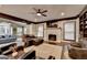 Open-concept living room featuring dark wood trim, hardwood floors, and fireplace at 2230 Cammie Wages Rd, Dacula, GA 30019