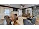 The living room features a fireplace, a ceiling fan, built-in shelving, and leather furniture at 2230 Cammie Wages Rd, Dacula, GA 30019