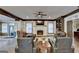 A comfortable living room with a fireplace, built-in shelving, and leather seating at 2230 Cammie Wages Rd, Dacula, GA 30019
