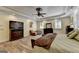 Spacious Primary bedroom featuring LVP flooring, plantation shutters, ceiling fan, and trey ceiling at 2230 Cammie Wages Rd, Dacula, GA 30019