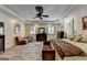 Spacious Primary bedroom featuring LVP flooring, plantation shutters, ceiling fan, and trey ceiling at 2230 Cammie Wages Rd, Dacula, GA 30019