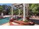 Beautiful pool featuring a gazebo, stone deck, landscaping, and a well-maintained garden at 2230 Cammie Wages Rd, Dacula, GA 30019