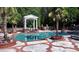 Large in-ground pool with patio, brick planters, a garden pavilion and mature landscaping at 2230 Cammie Wages Rd, Dacula, GA 30019