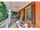 Inviting porch with rocking chairs and views of lush greenery at 2230 Cammie Wages Rd, Dacula, GA 30019