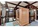 Beautiful sauna off of the exercise room with a wood finish and glass door for a relaxing home spa at 2230 Cammie Wages Rd, Dacula, GA 30019