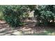 Secluded sitting area with custom benches surrounded by lush landscaping at 2230 Cammie Wages Rd, Dacula, GA 30019