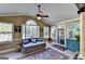 Cozy sunroom features many windows for natural light and exterior views at 2230 Cammie Wages Rd, Dacula, GA 30019
