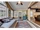Cozy sunroom featuring many windows for natural light and exterior views with open access to living room at 2230 Cammie Wages Rd, Dacula, GA 30019