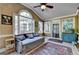 Cozy sunroom features many windows for natural light and exterior views at 2230 Cammie Wages Rd, Dacula, GA 30019