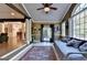 Cozy sunroom featuring many windows for natural light and exterior views with open access to living room at 2230 Cammie Wages Rd, Dacula, GA 30019