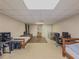 Spacious finished basement with carpet and wood flooring, two beds, and natural light at 3241 Briscoe Rd, Loganville, GA 30052