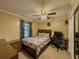 Bedroom features a bed, desk, and closet, with a ceiling fan for added comfort at 3241 Briscoe Rd, Loganville, GA 30052
