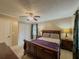 Comfortable bedroom with a ceiling fan, dual nightstands, and closet space at 3241 Briscoe Rd, Loganville, GA 30052