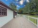 Back deck of the home with white rails and a view of the yard at 3241 Briscoe Rd, Loganville, GA 30052