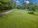 Beautiful property featuring a well-maintained lawn, mature trees, and a peaceful, natural setting at 3241 Briscoe Rd, Loganville, GA 30052